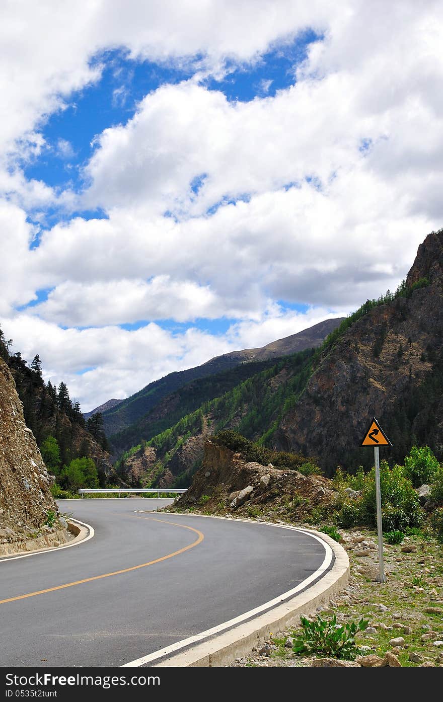 A curved road in the mountains. A curved road in the mountains