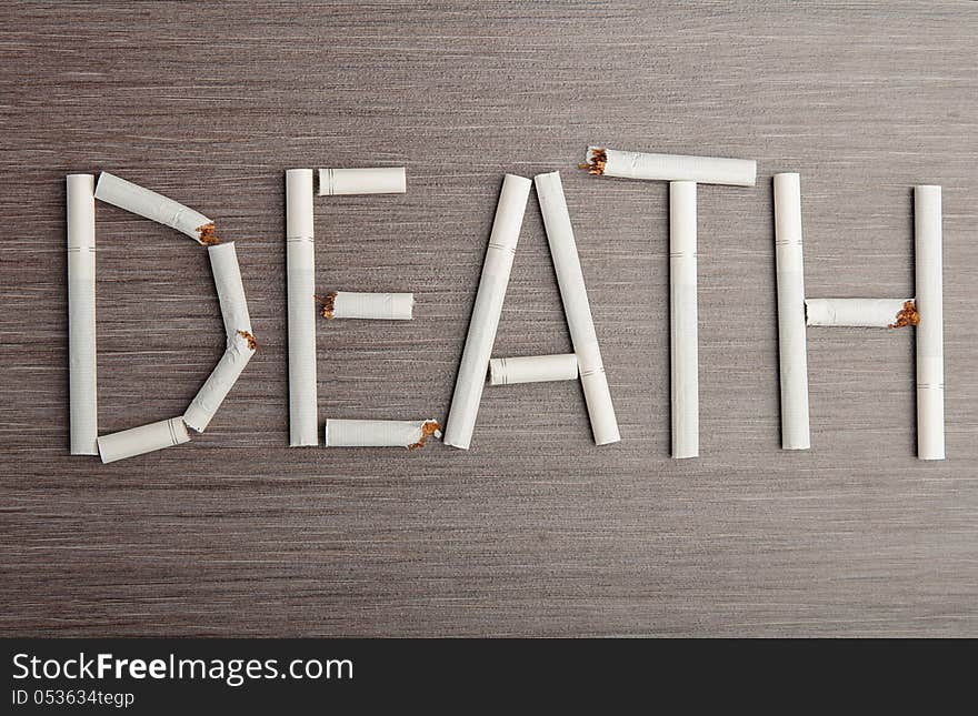 Concept of the dangers of smoking. the word death of cigarettes. Concept of the dangers of smoking. the word death of cigarettes