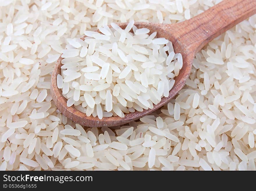 Raw white rice in wooden spoon on burlap, food ingredient photo. Raw white rice in wooden spoon on burlap, food ingredient photo