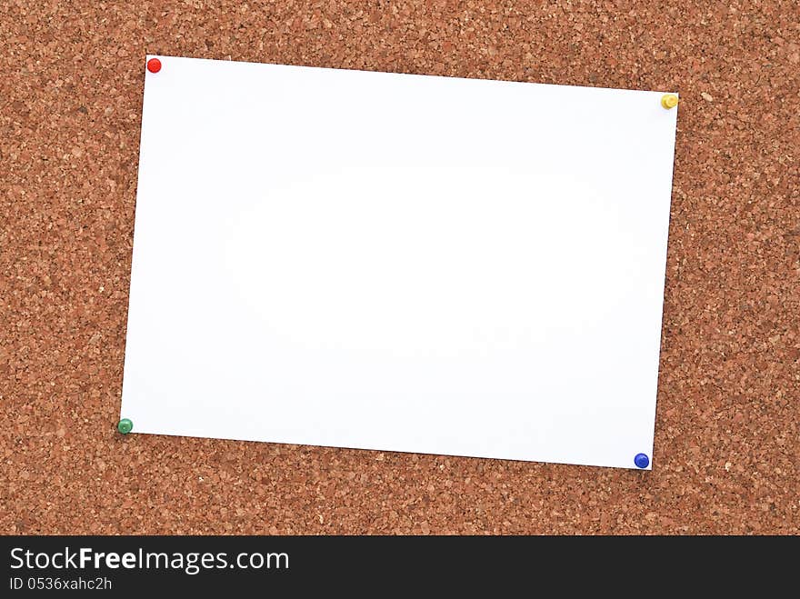 Cork board with paper attached to it. Cork board with paper attached to it.