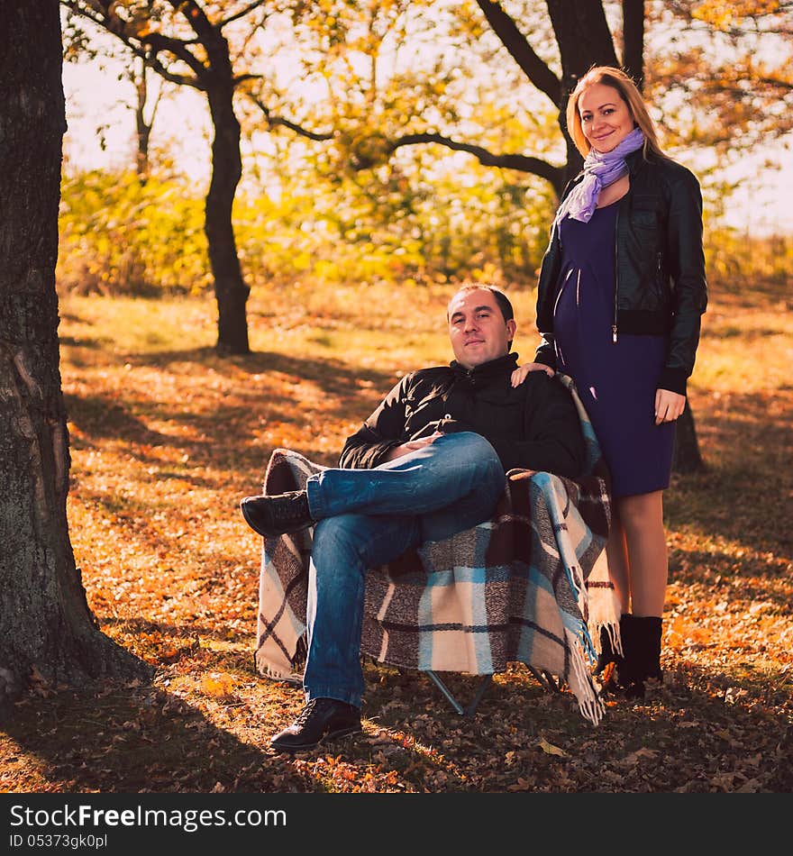 Family in autumn forest