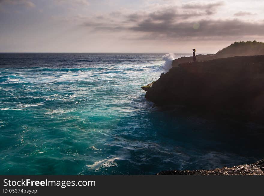 Sunset on Devil's tear - landmark of small island Nusa Lembongan, Indonesia. Sunset on Devil's tear - landmark of small island Nusa Lembongan, Indonesia