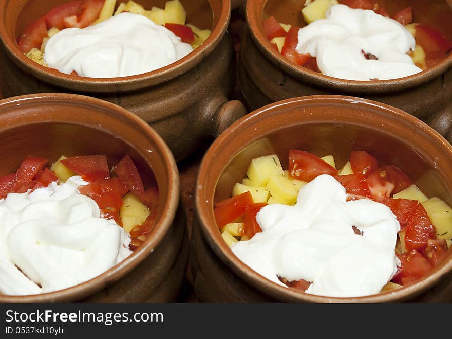 Vegetables for cooking with sour cream in clay pots