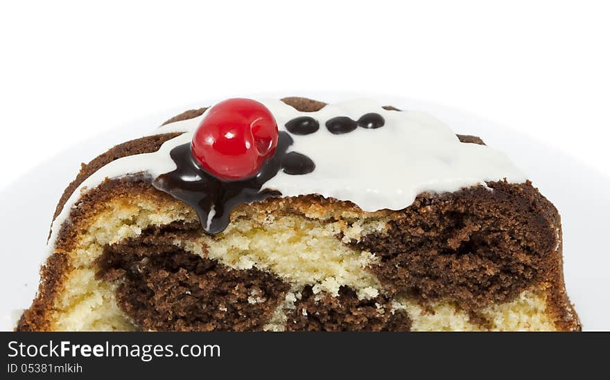 Marble cake with cherry isolated on white