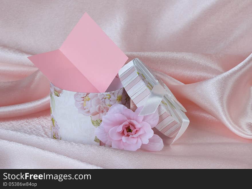 Gift box and a pink flowe