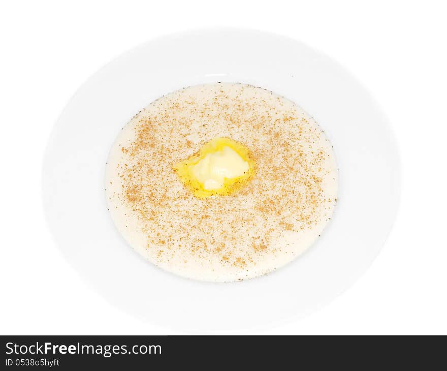 Porridge in a deep bowl with butter eye