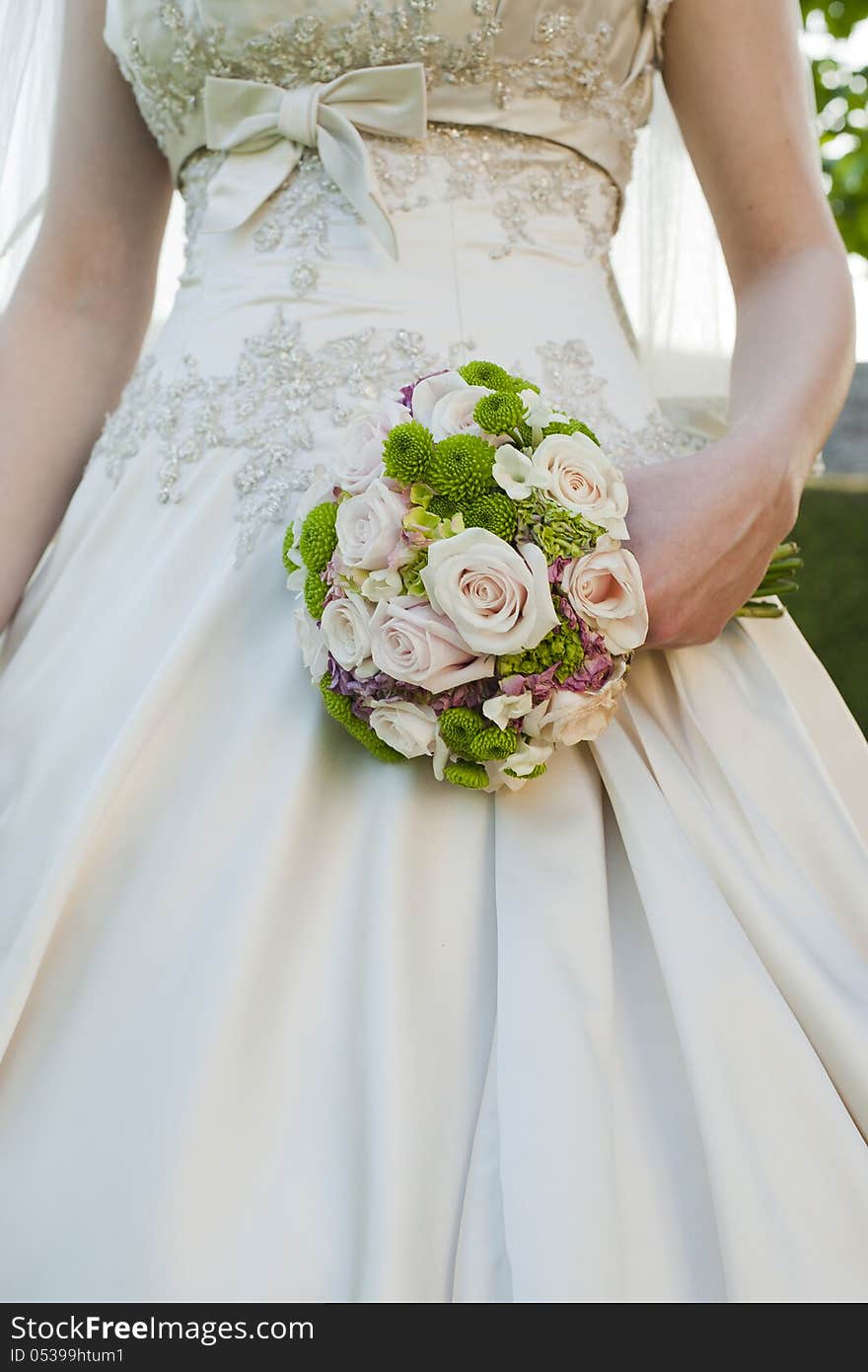 Wedding bouquet in brides hand