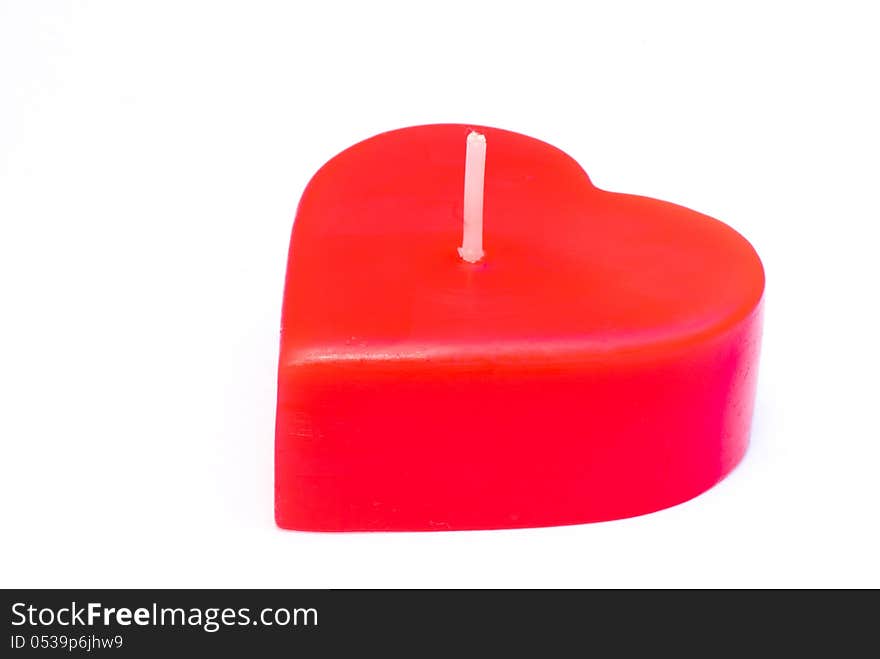 Candle of love on a white background.