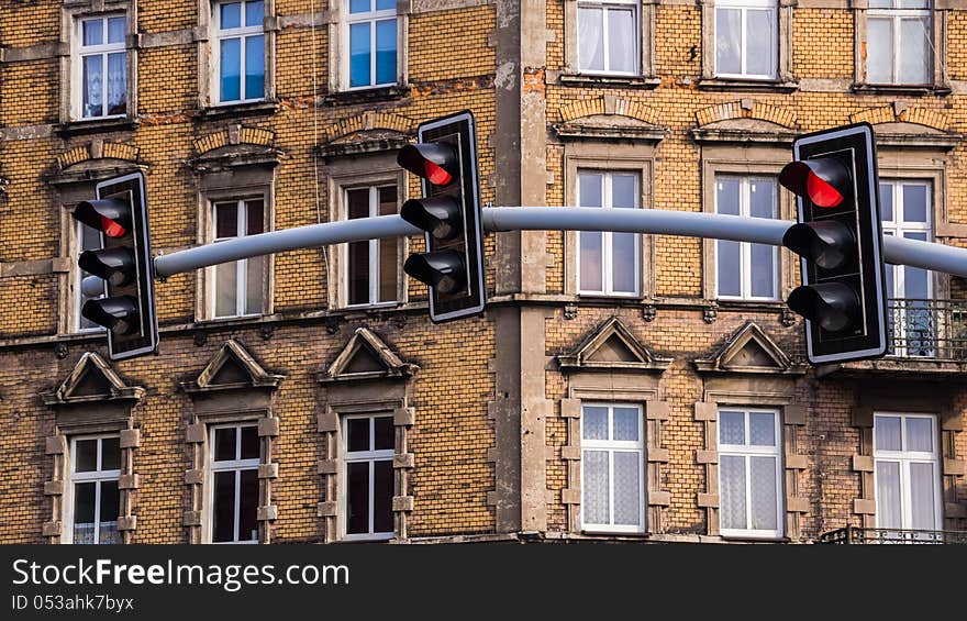 Traffic lights on the background of an old tenement in Bytom, Silesia region, Poland.