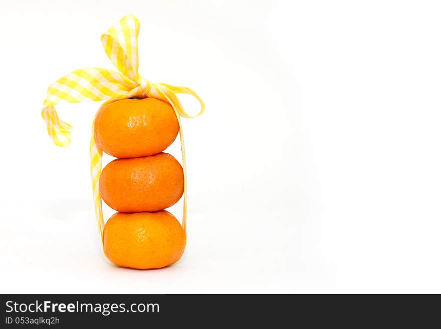 Tangerine And Tape On White Background