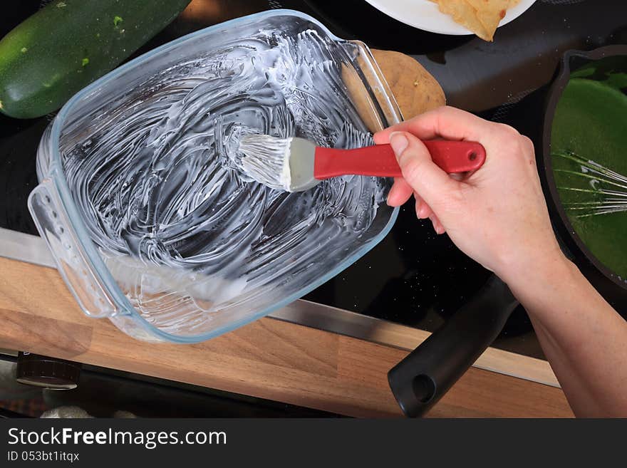 Closeup of Glass Bowl being Smeared With Fat