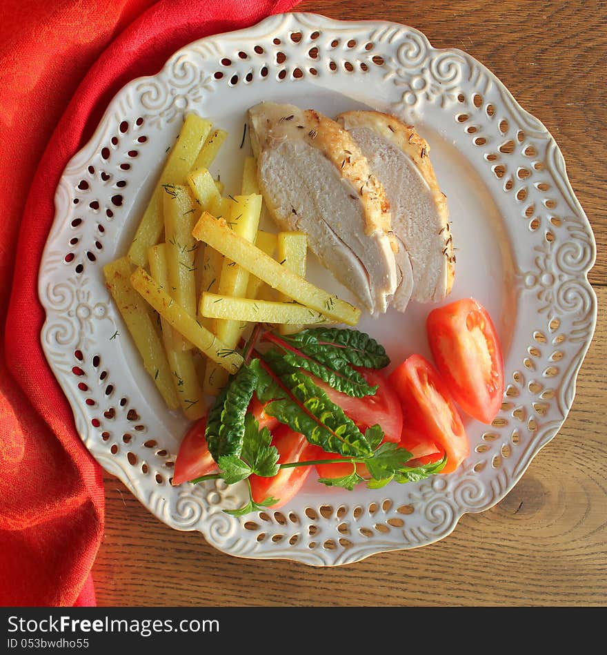 Chicken breast with vegetables and potatoes