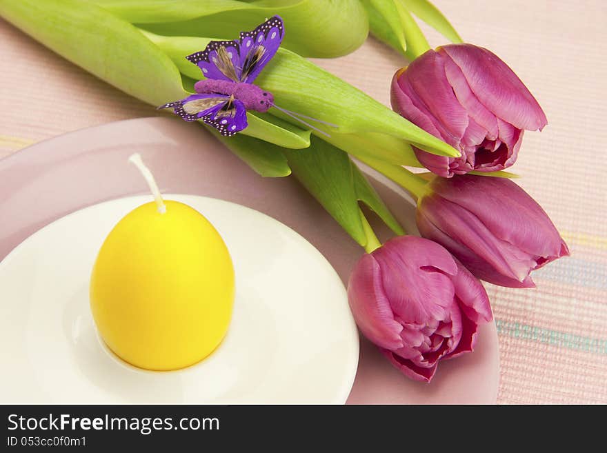 Easter composition with color tulips and candle. Easter composition with color tulips and candle