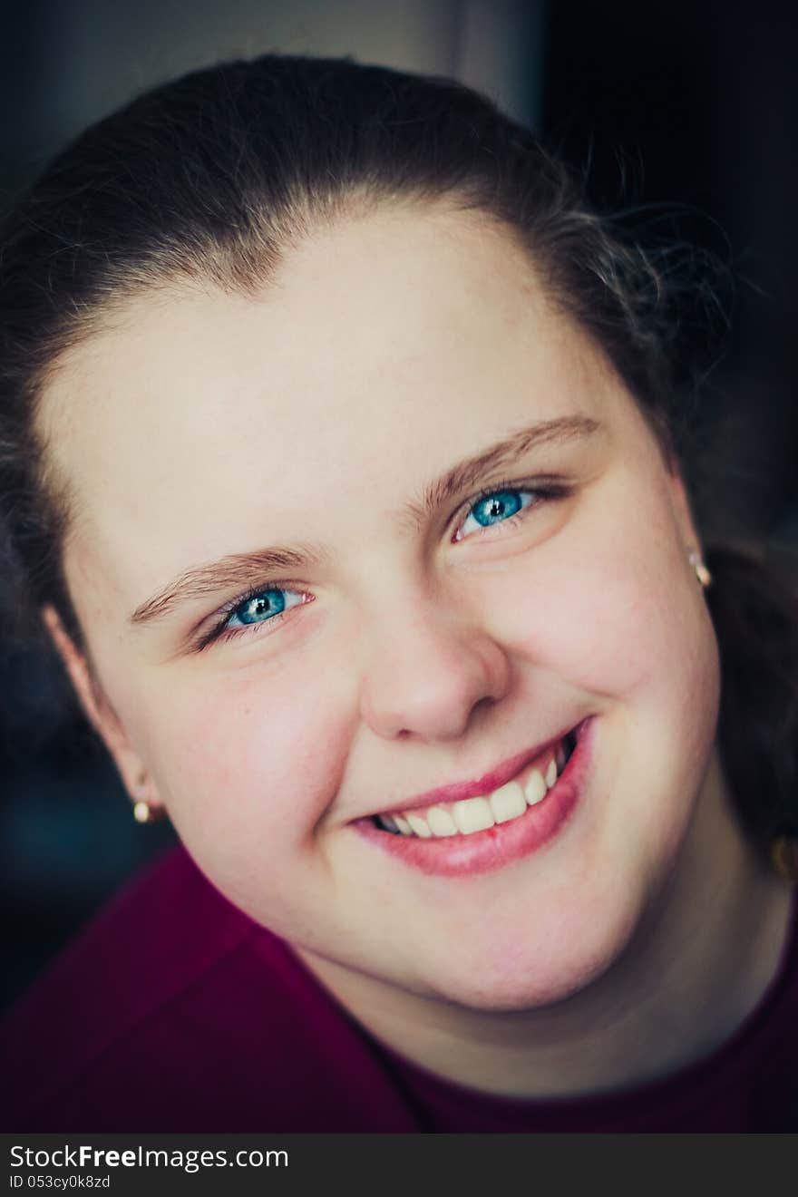 Close-Up Portrait Of A Happy Young Woman