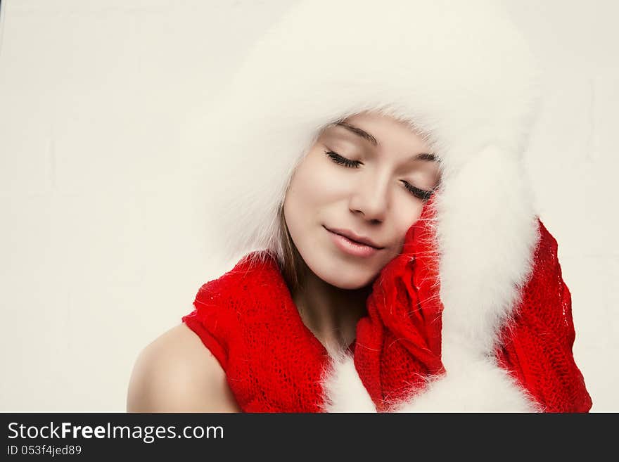 Fashion portrait of young beautiful woman posing on white background