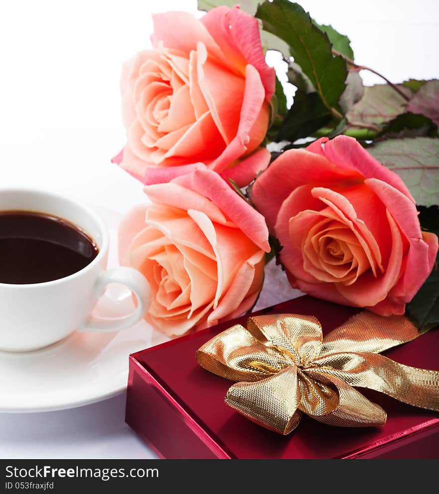 Flowers, cup of coffee and sweets.