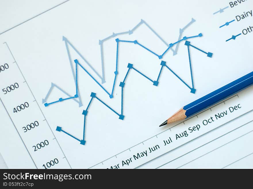 A business diagram and a blue pencil