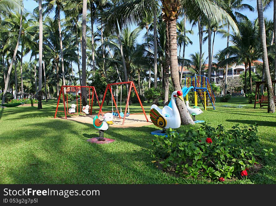 Children's playground at a beautiful park on a luxury tropical resort. Children's playground at a beautiful park on a luxury tropical resort