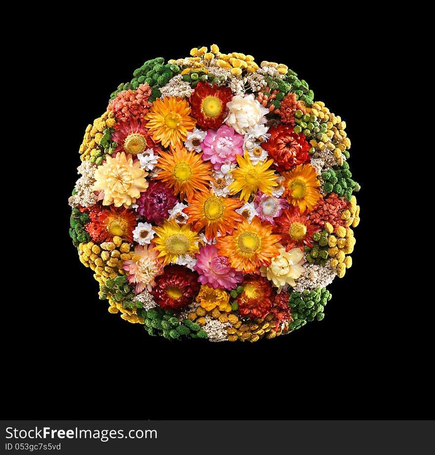 Colorful bouquet of dried flowers on a black background