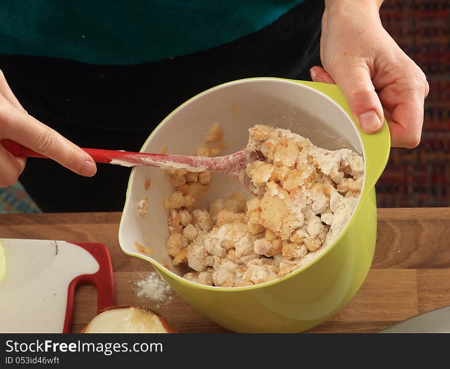 Bread pieces are mixed with egg and milk in a tumbler in order to make bread dumplings. Bread pieces are mixed with egg and milk in a tumbler in order to make bread dumplings