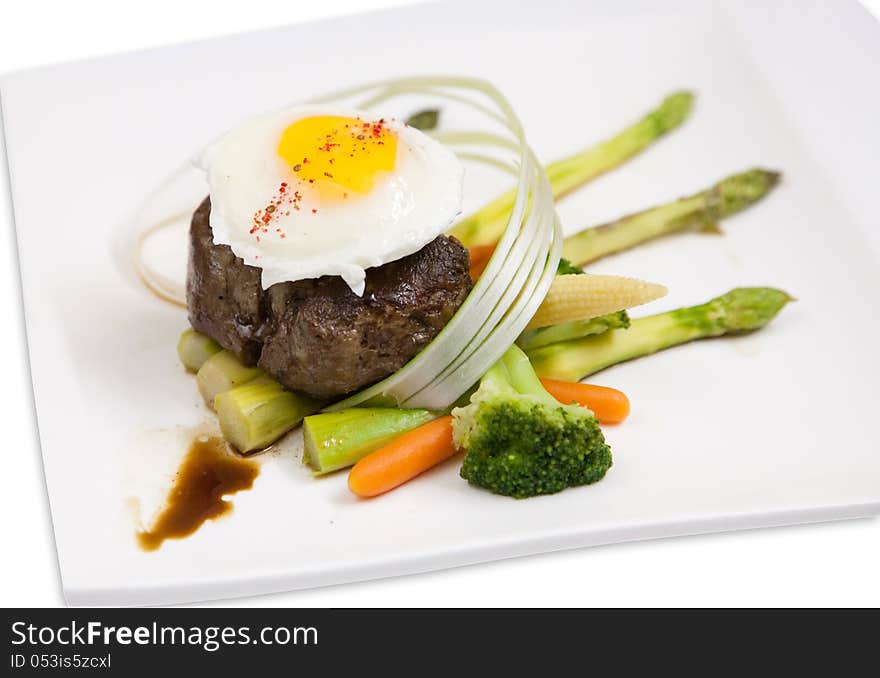 Steak  with egg  also vegetables on pair on breakfast. Steak  with egg  also vegetables on pair on breakfast