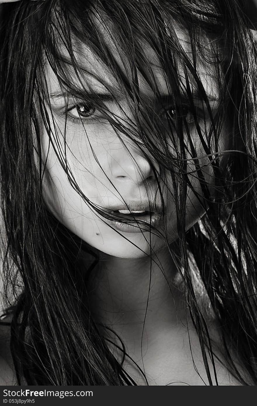 Closeup portrait of a beautiful young woman with elegant long shiny hair