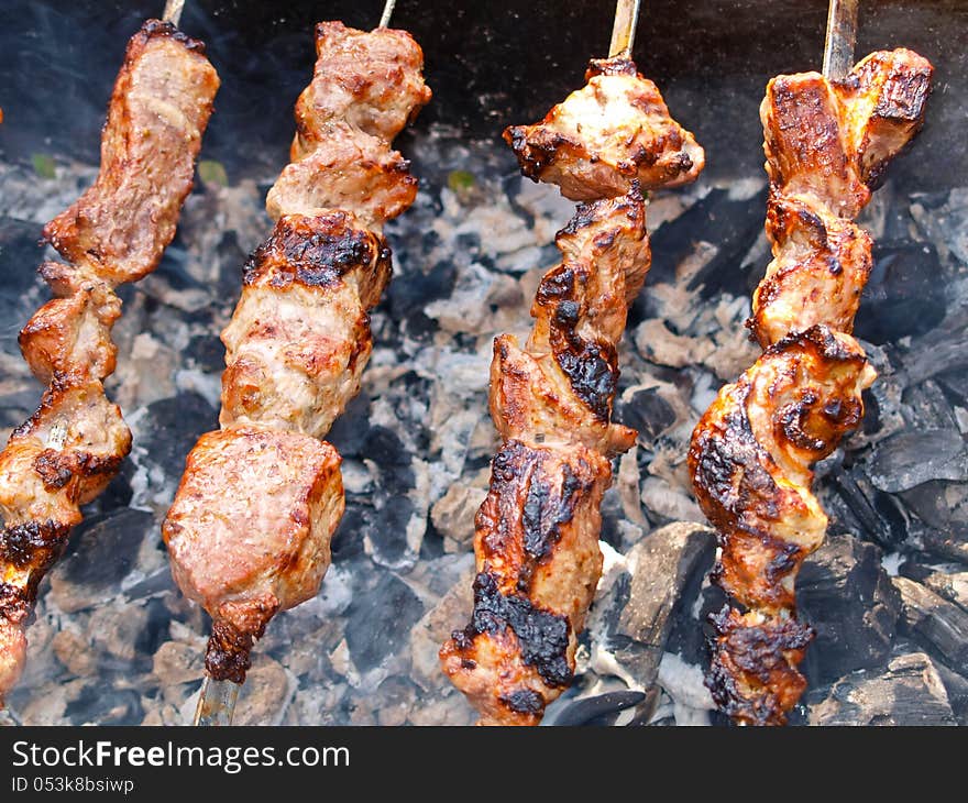 Roasted kebabs on the grill