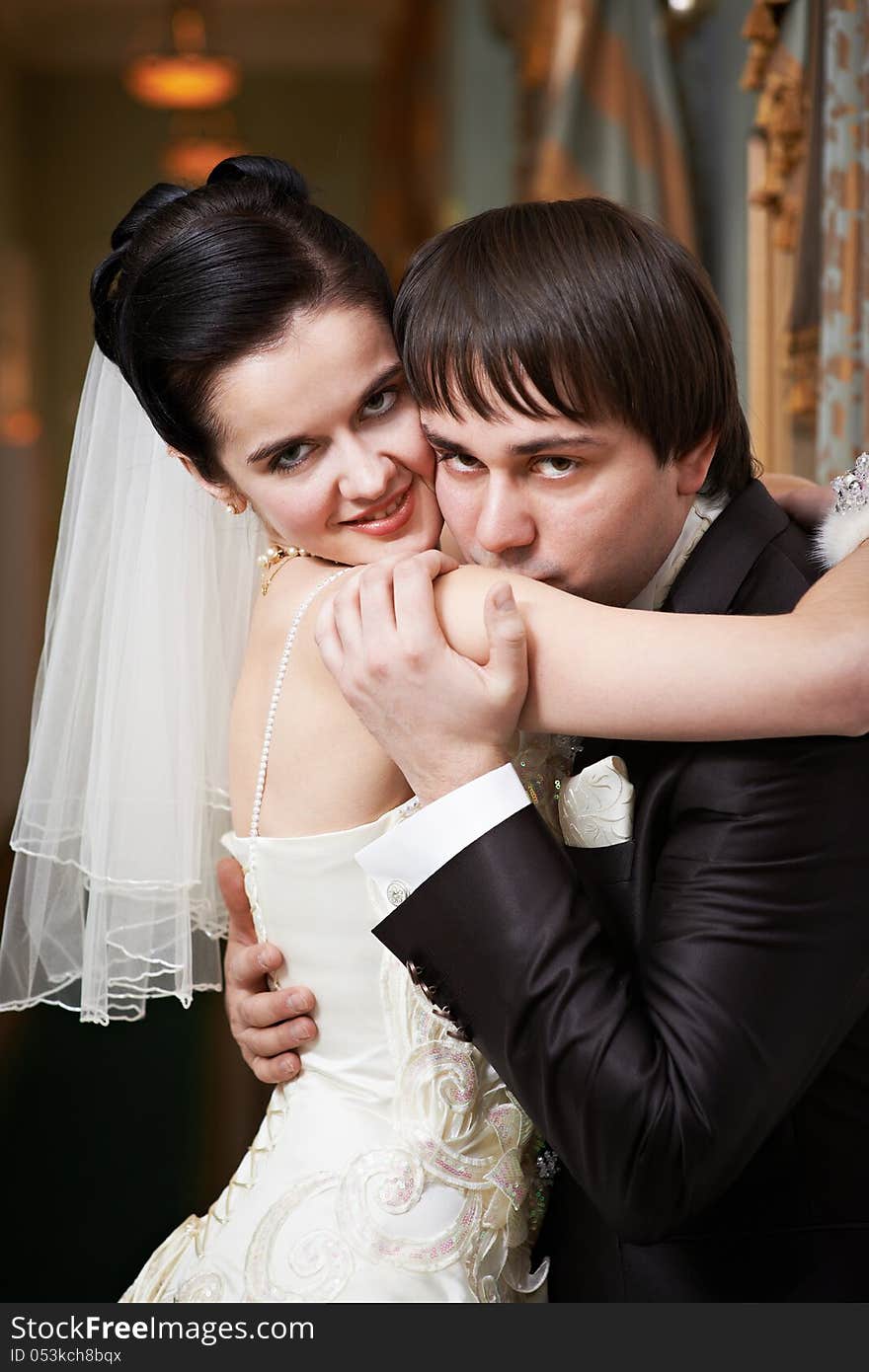 Romantic kiss happy bride and groom