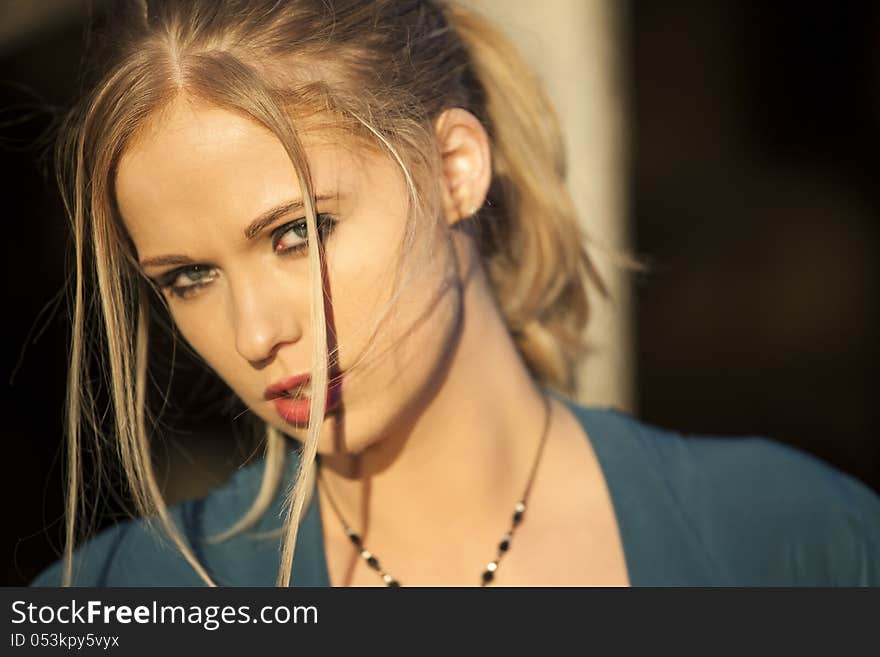 Portrait of a young woman staring straight ahead into the camera. Portrait of a young woman staring straight ahead into the camera