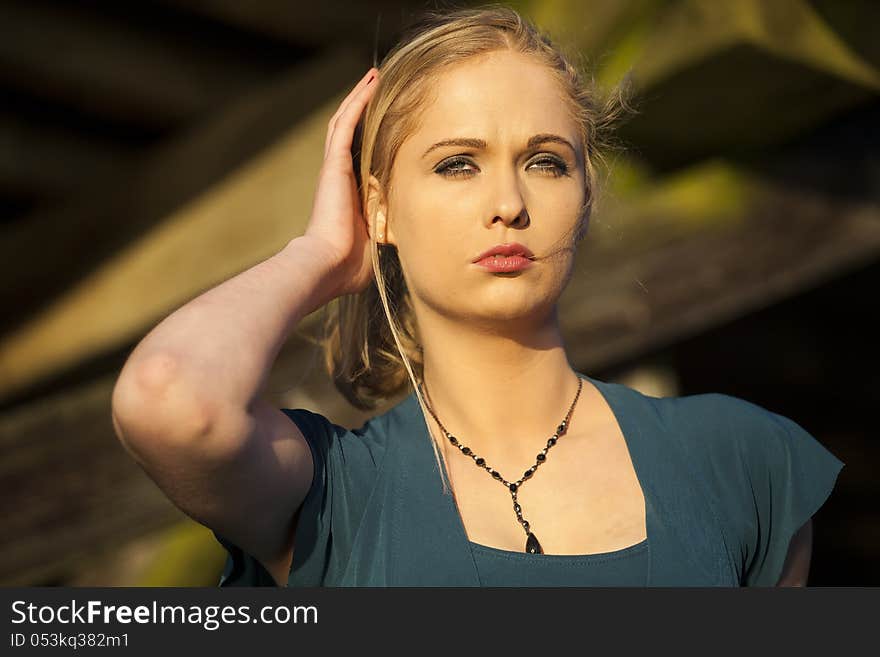 Portrait of a young woman staring straight ahead into the camera. Portrait of a young woman staring straight ahead into the camera