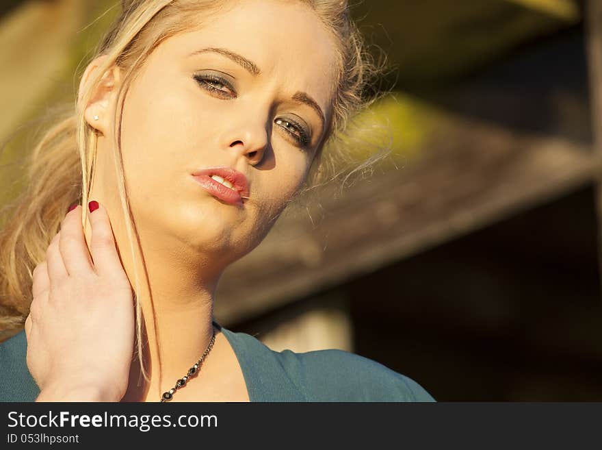 Portrait of a young woman staring straight ahead into the camera. Portrait of a young woman staring straight ahead into the camera