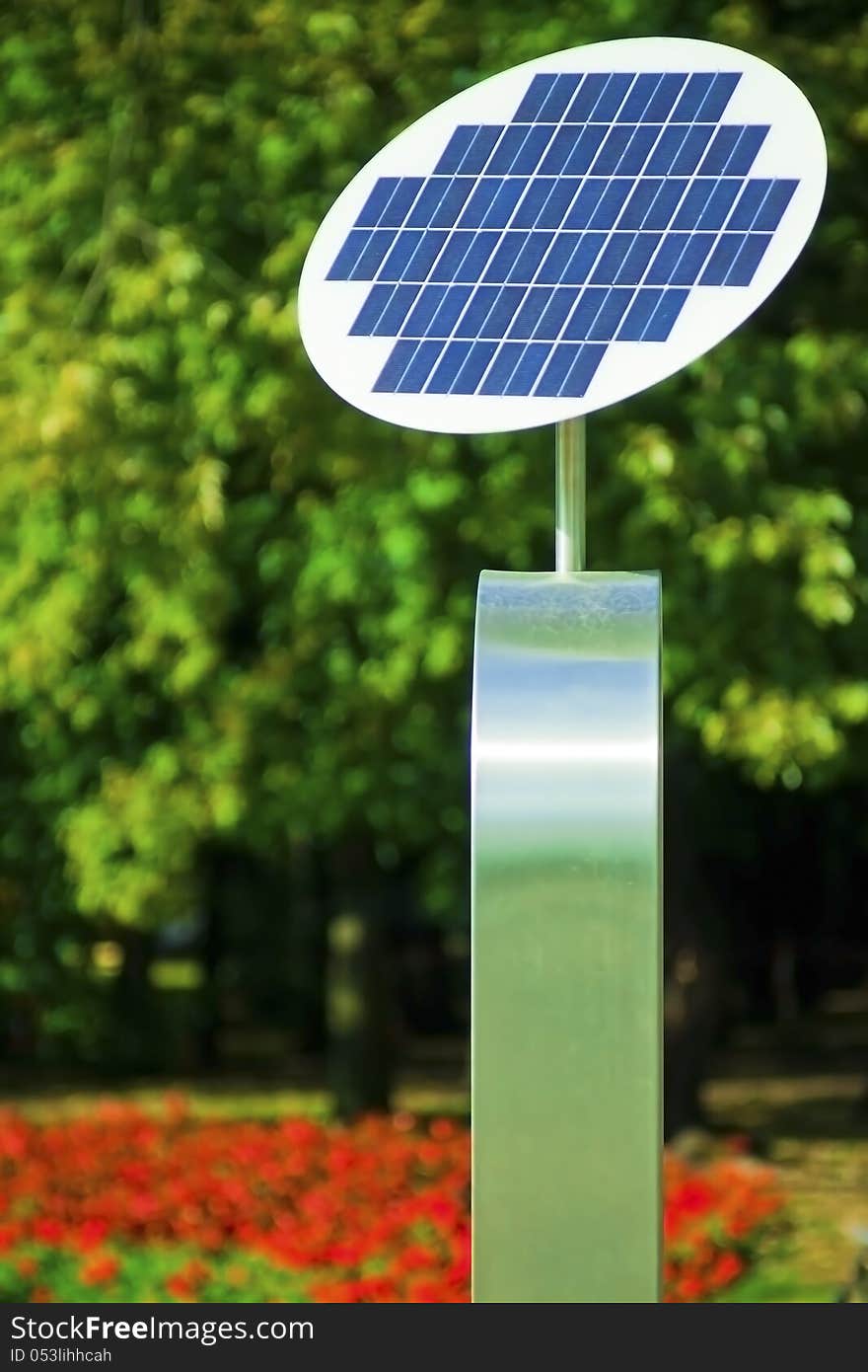 A photovoltaic Solar Panel with tree in the background. A photovoltaic Solar Panel with tree in the background.