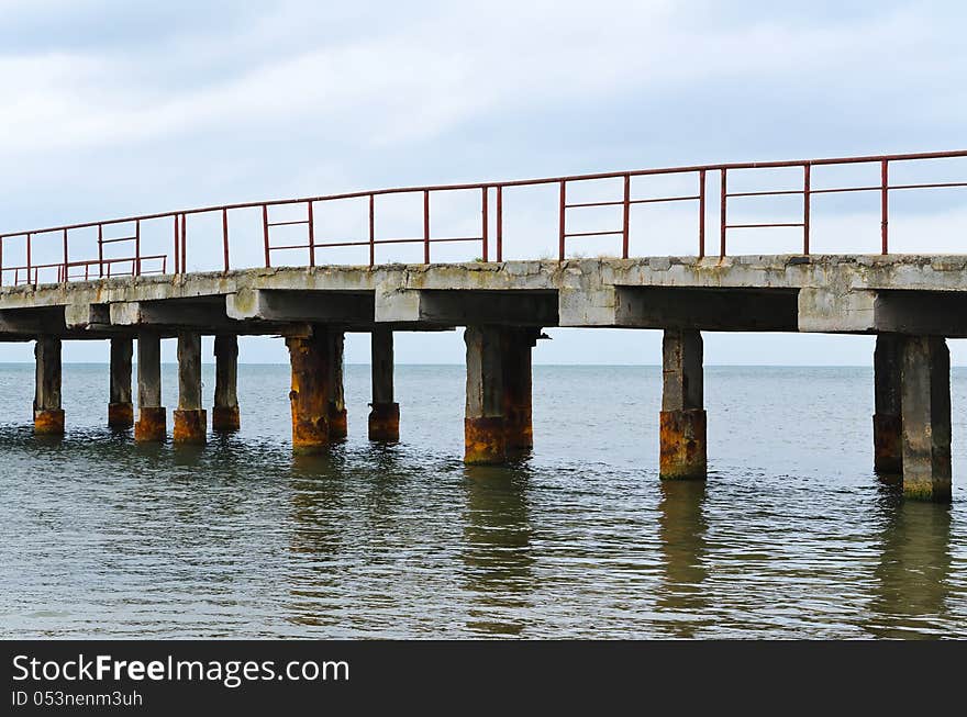 Deserted old bridge. rusty and unusable. ferroconcrete construct