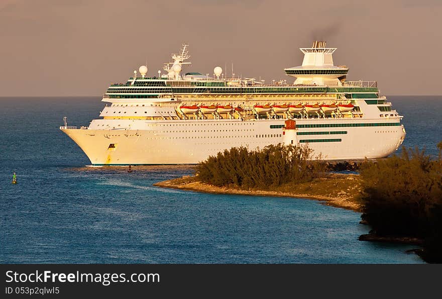 Cruise Ship entering harbor in Nassau, Bahamas at sunrise