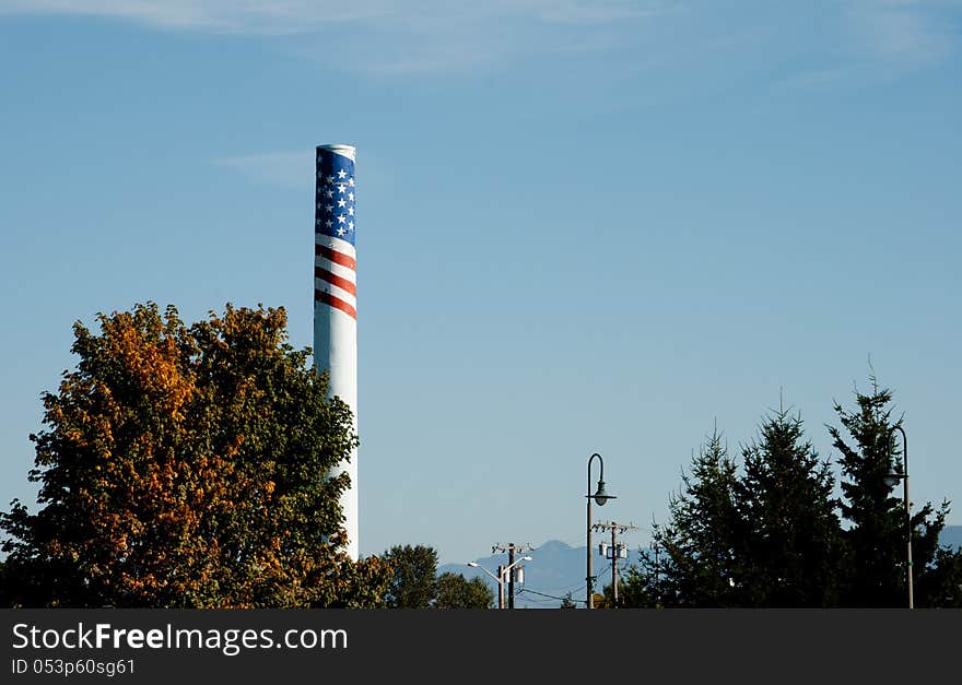 Tall smokestack with painted patriotic flag motif. Tall smokestack with painted patriotic flag motif