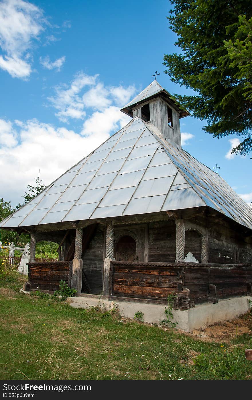 Old traditional Romanian wooden church in a mountain village. Old traditional Romanian wooden church in a mountain village