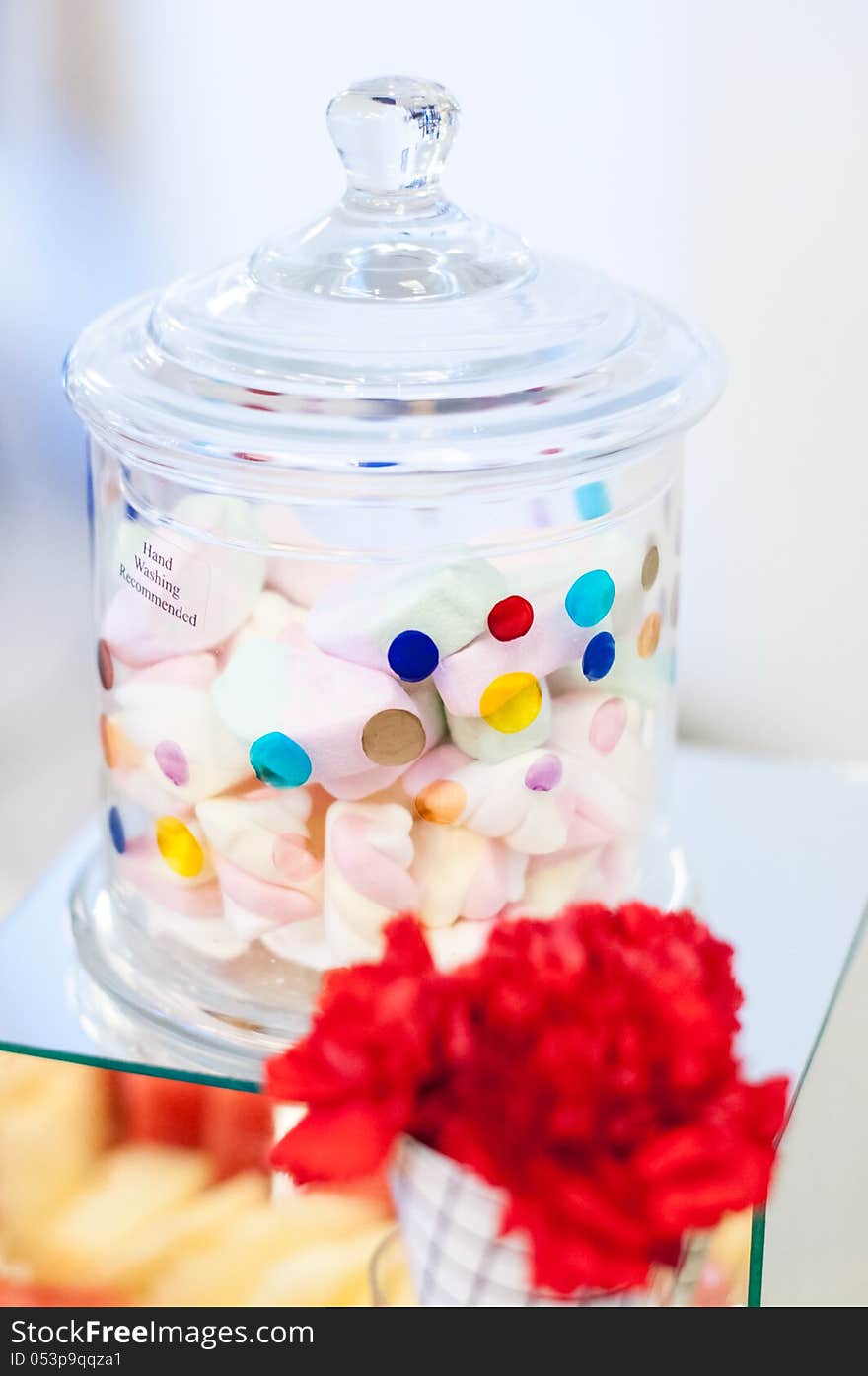 Delicious colored soft candy in a jar for an event candy bar. Delicious colored soft candy in a jar for an event candy bar