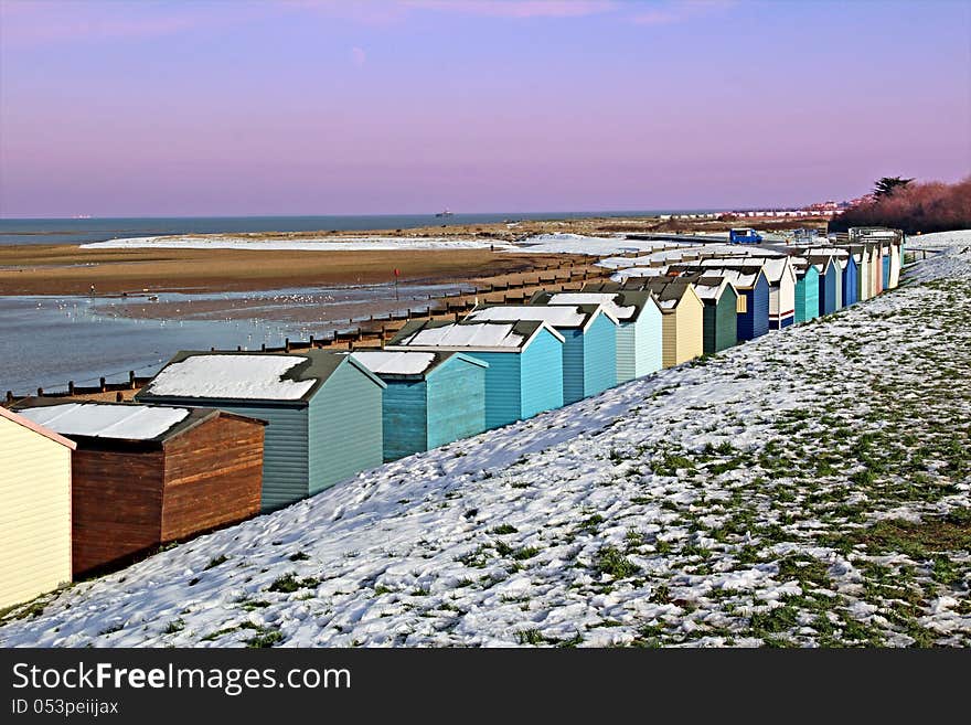 Photo of beach huts located along the coastline of whitstable in kent covered in winter snow. photo taken on 22nd January 2013. Photo of beach huts located along the coastline of whitstable in kent covered in winter snow. photo taken on 22nd January 2013.