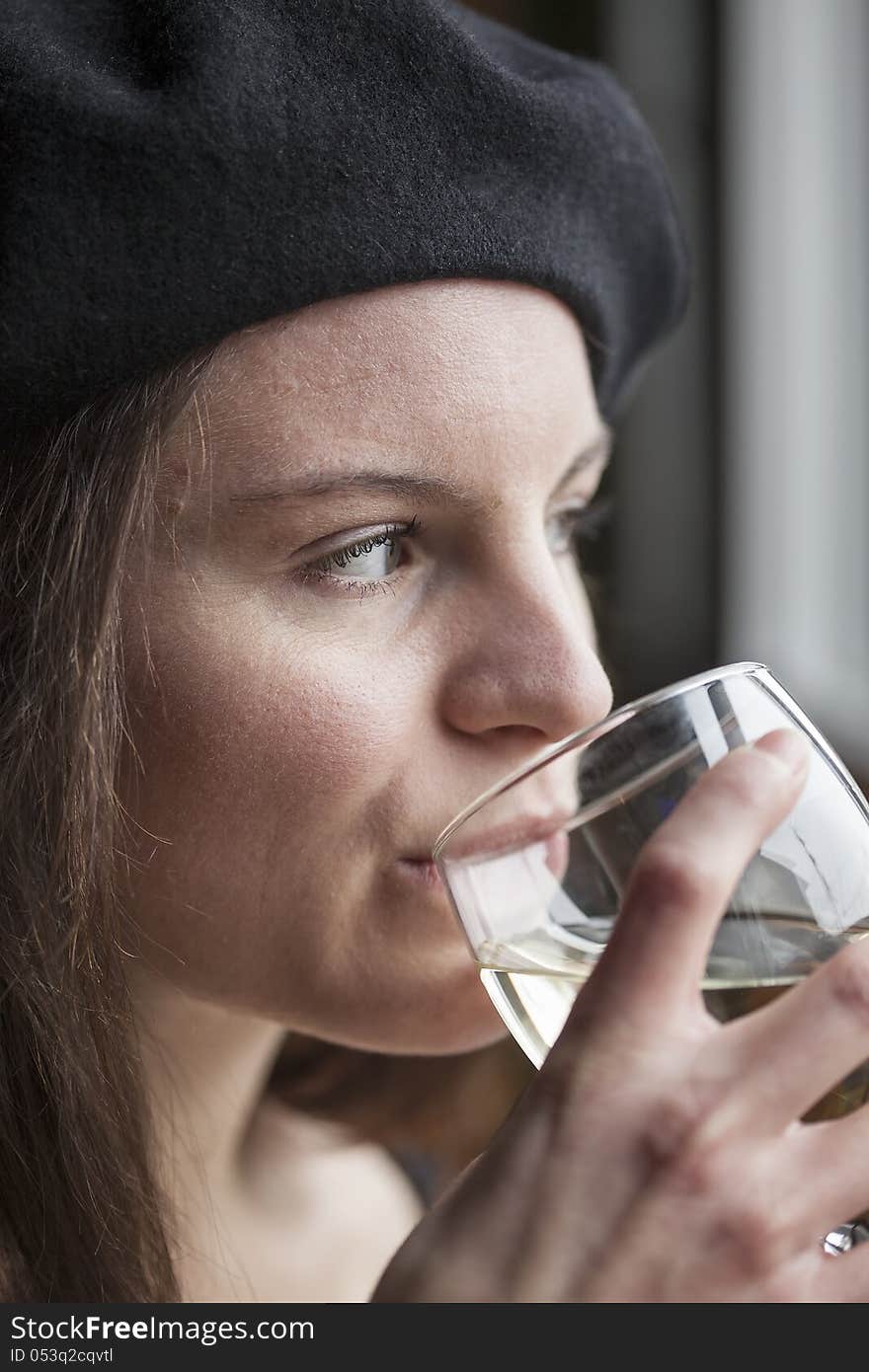 Portrait of a young woman with white wine. Portrait of a young woman with white wine.