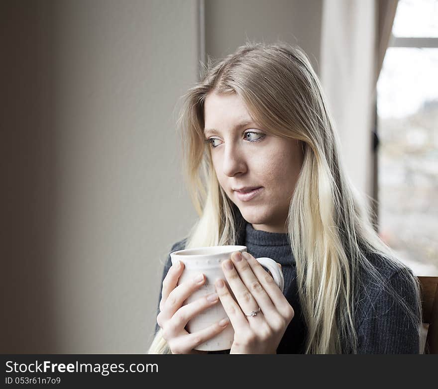 Young Woman Drinking Coffee