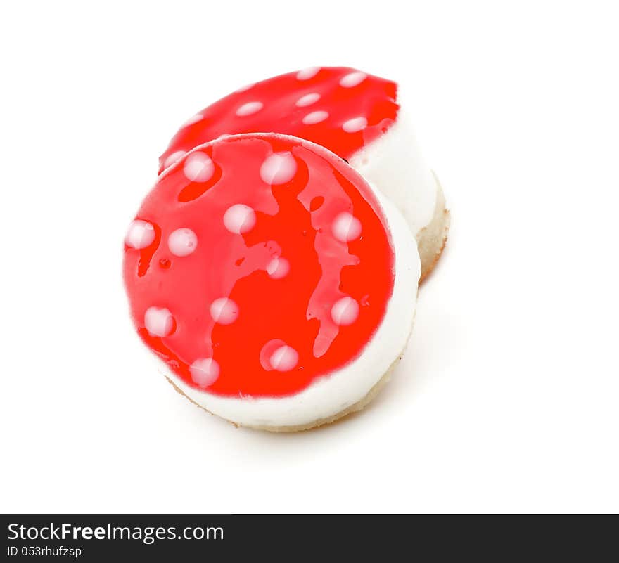 Two Polka Dot Cheesecakes with Strawberry Jelly closeup on white background