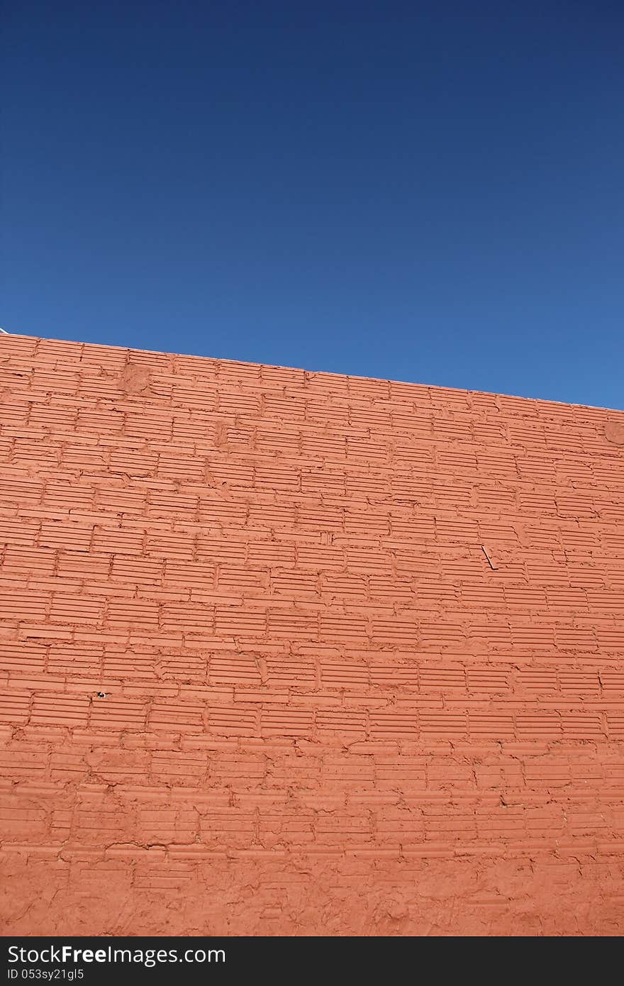 Clear blue sky brick wall