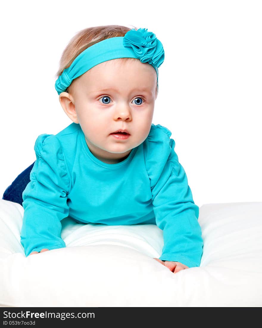 Portrait of a little child lying on a bed