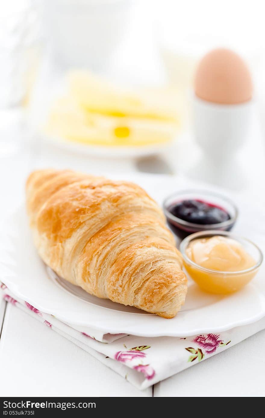 French breakfast with croissant, cheese, egg and jam. French breakfast with croissant, cheese, egg and jam