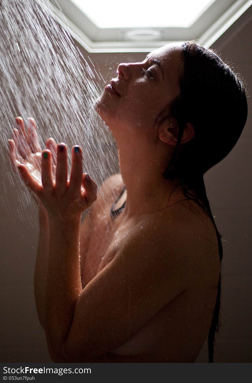 Happy Young Woman in Shower