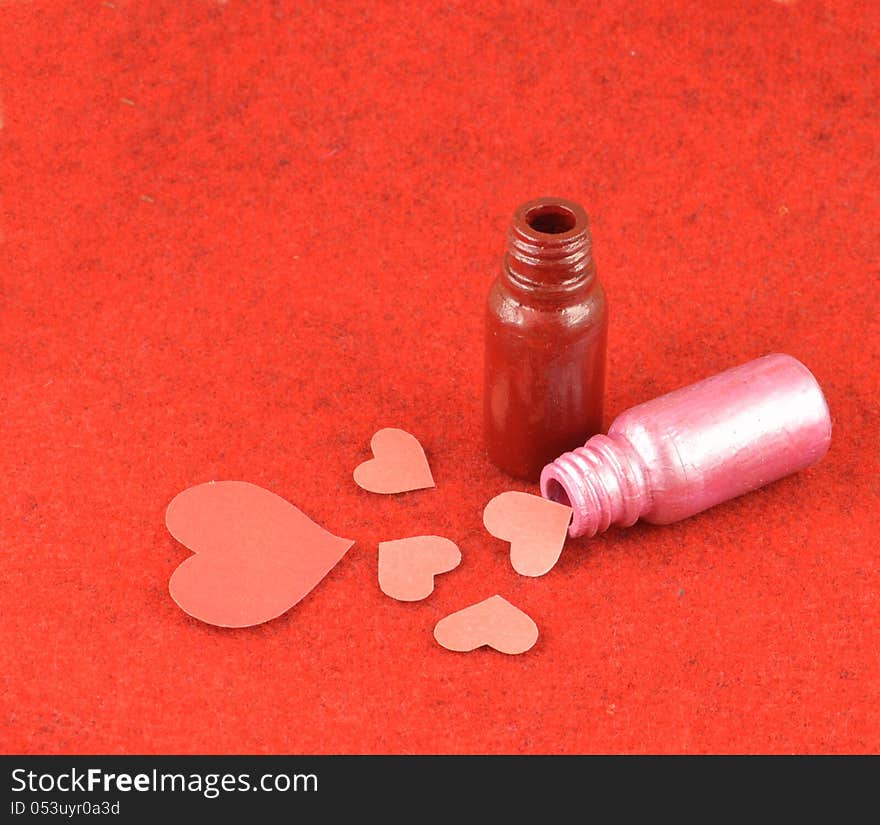 Magic bottles with pink hearts made of paper. Magic bottles with pink hearts made of paper