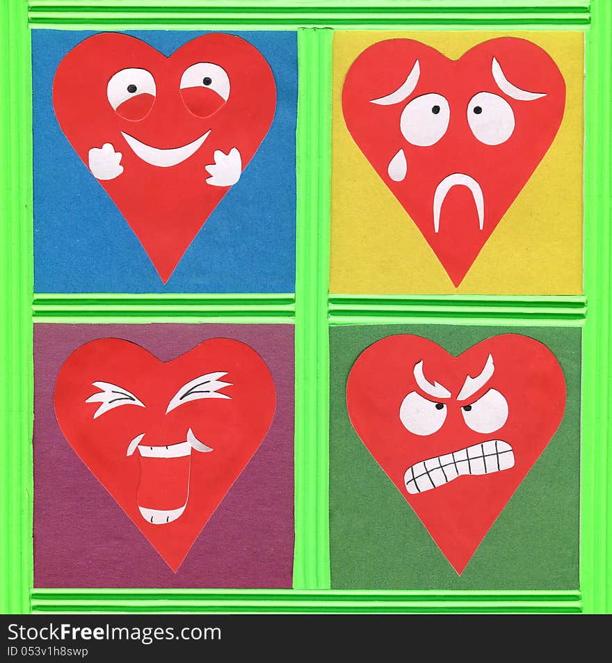 Colorful paper cutout with funny heart faces. Colorful paper cutout with funny heart faces