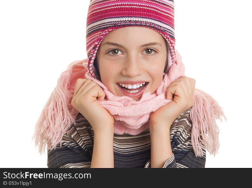 Beautiful young girl in warm winter clothes isolated on white