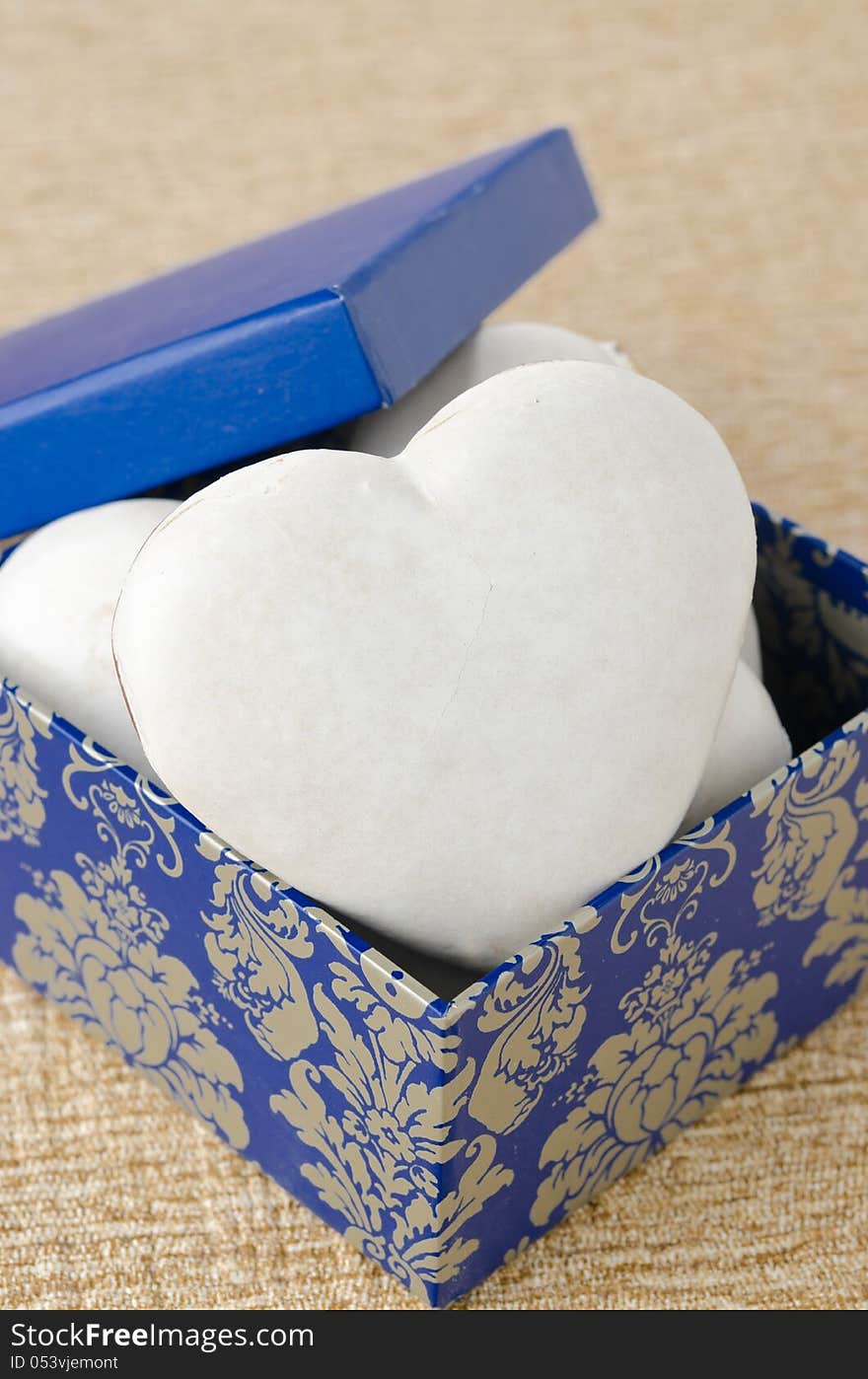 Cake with icing in the form of heart in a gift box, vertical. Cake with icing in the form of heart in a gift box, vertical