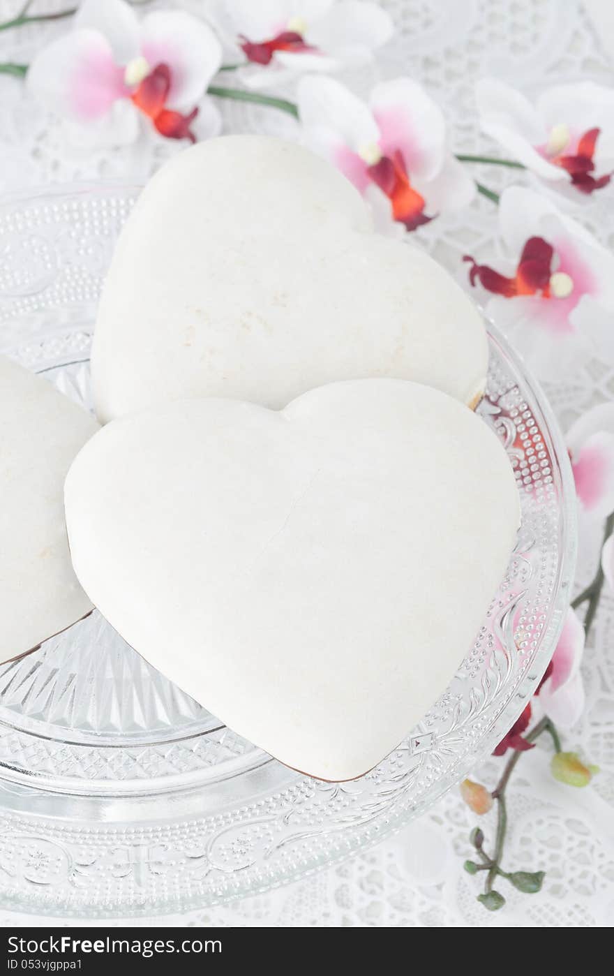 Cookies with icing in the form of heart on a glass base, selecti